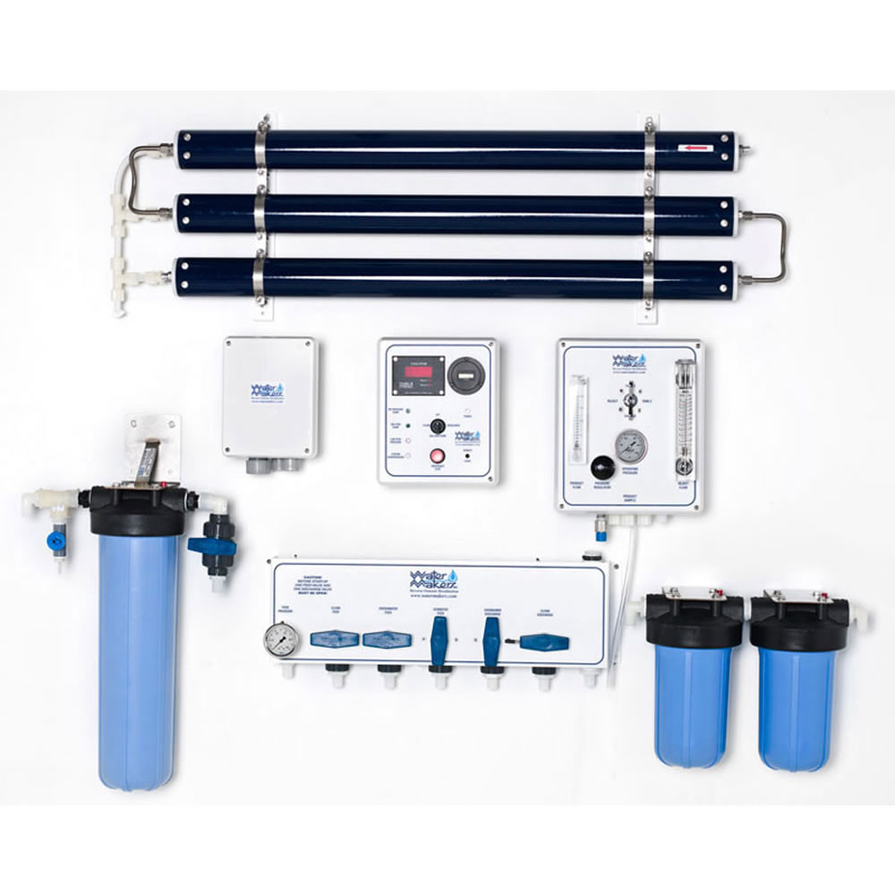 Watermakers | Advanced Reverse Osmosis Desalination Systems - Watermaker WMS-1700 reverse osmosis desalination system in a modular, wall-mounted configuration. Blue and black pipes and white system boxes with dials and gauges.