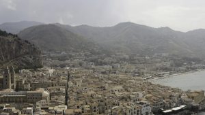 using a watermaker and showing a Aerial view of the stony coast, azure sea, and the European city in Italy. Action. Travel and holyday concept, beautiful houses near the sea.