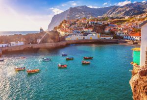 using a watermaker in madrid. The beautiful fishing village of Camara de Lobos on the portugese Island of Madeira in warm evening sunshine light.